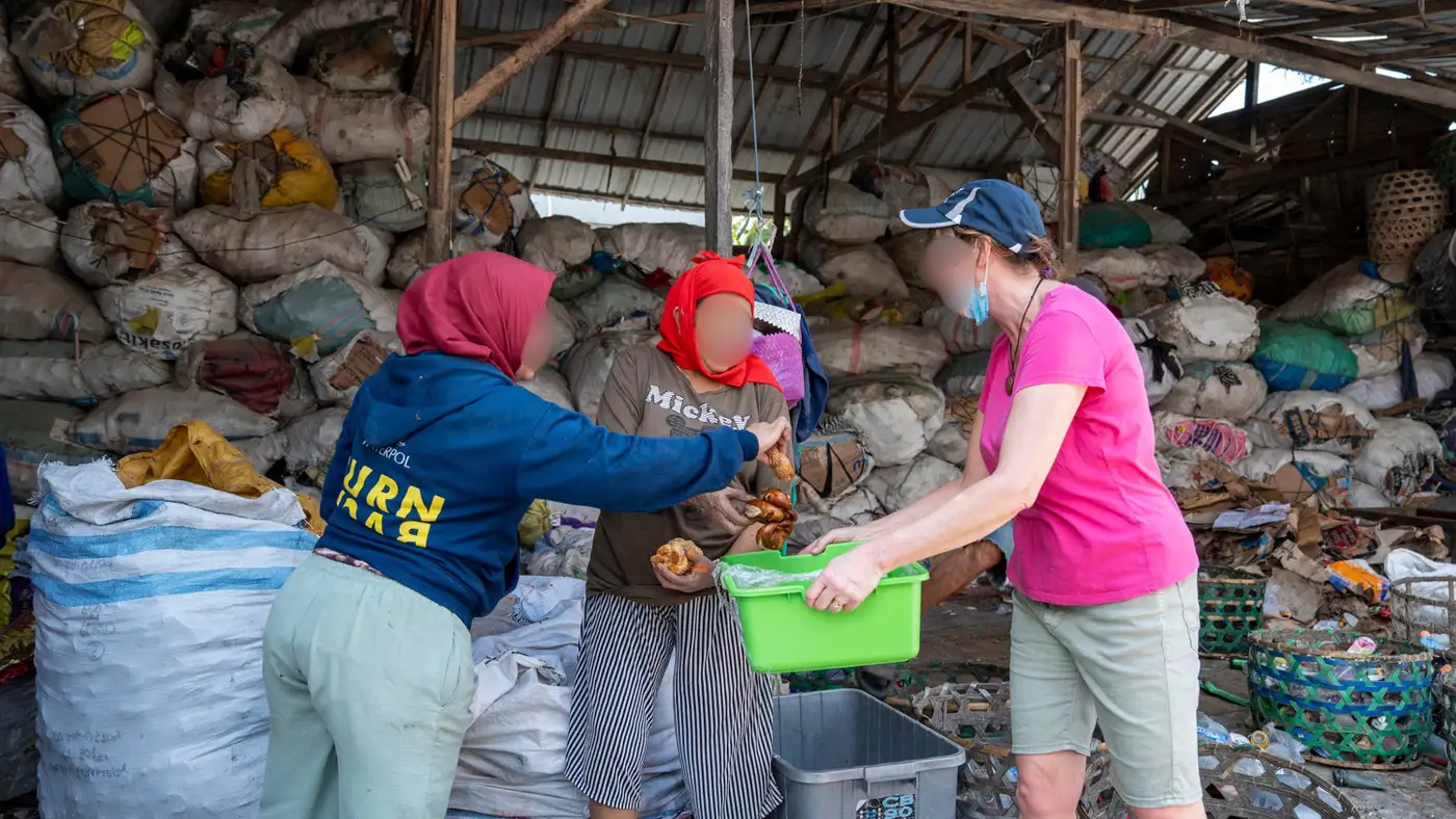 Volunteers preparing rescued ingredients into community meals