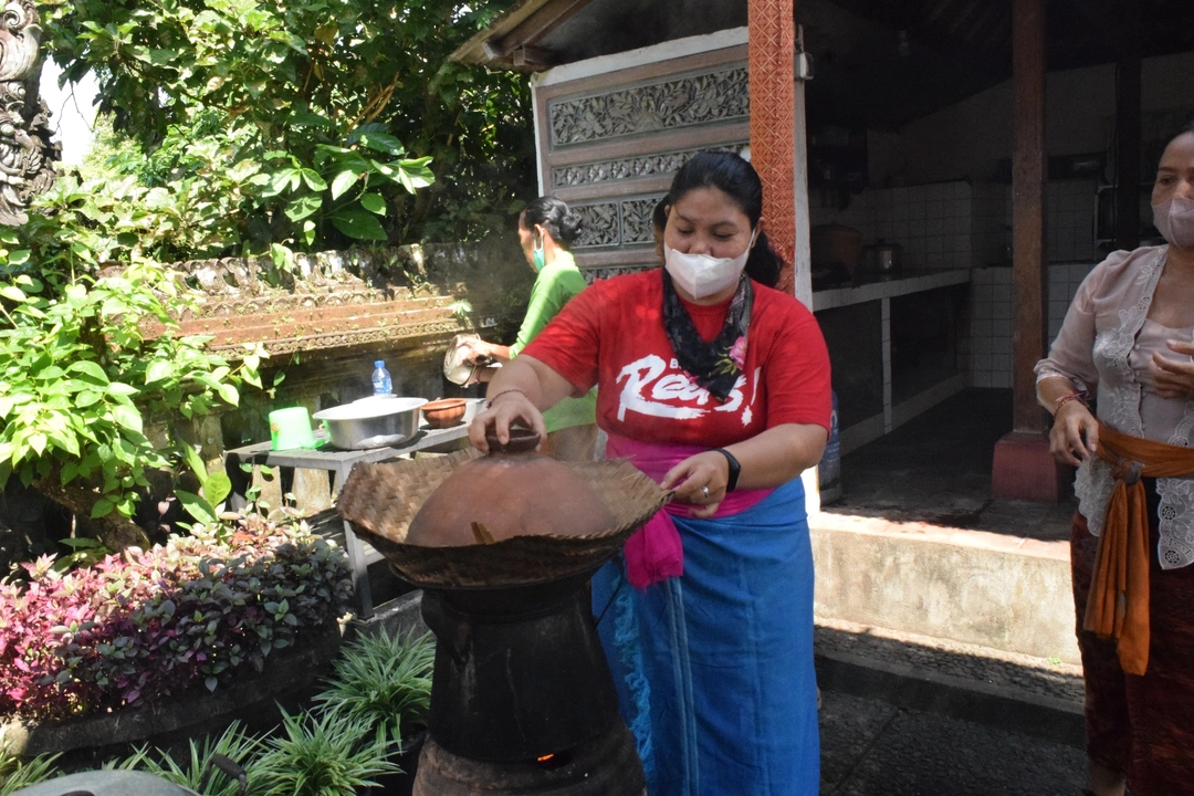 Hands-on Balinese cooking session with fresh ingredients in culinary tour