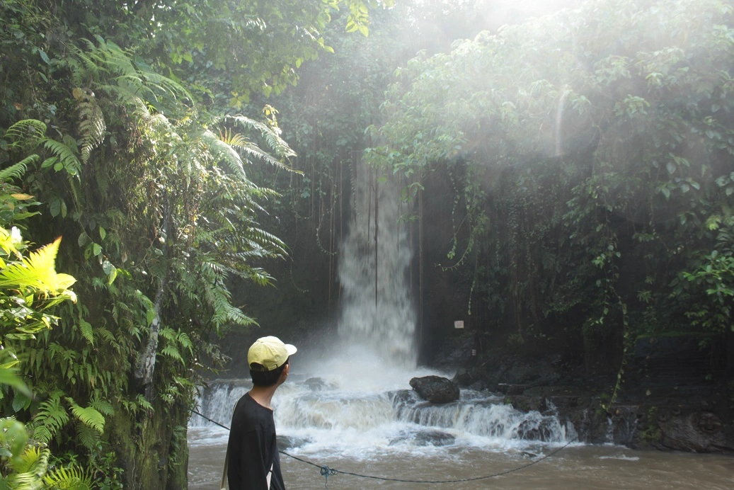 Hidden waterfall during Bali Village Trekking paddy field and countryside experience