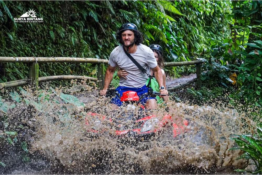 ATV activity through muddy water track in Bali