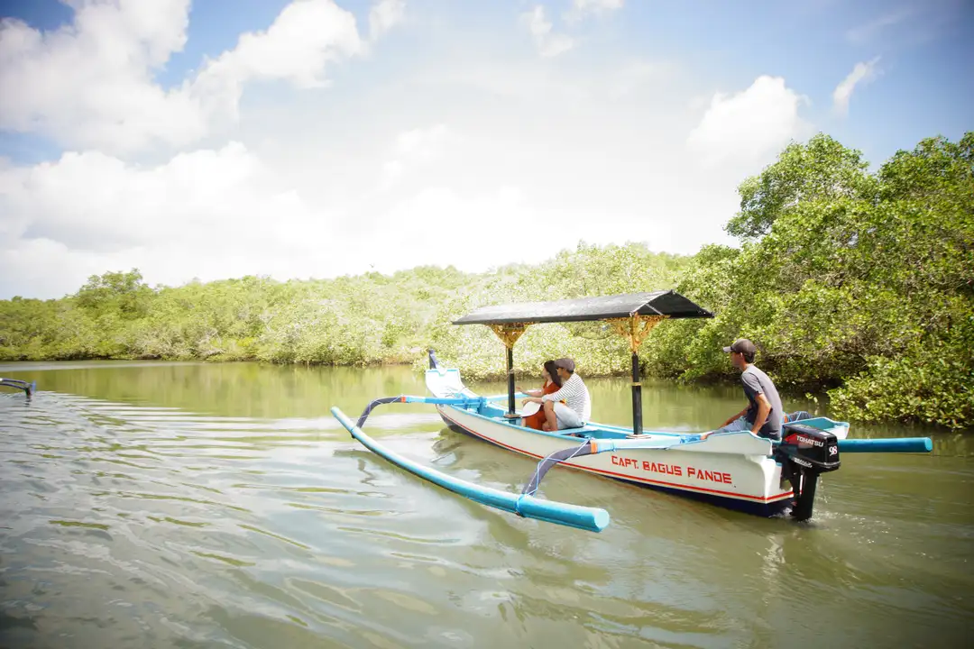 Traditional jukung boat tour through Bali forest