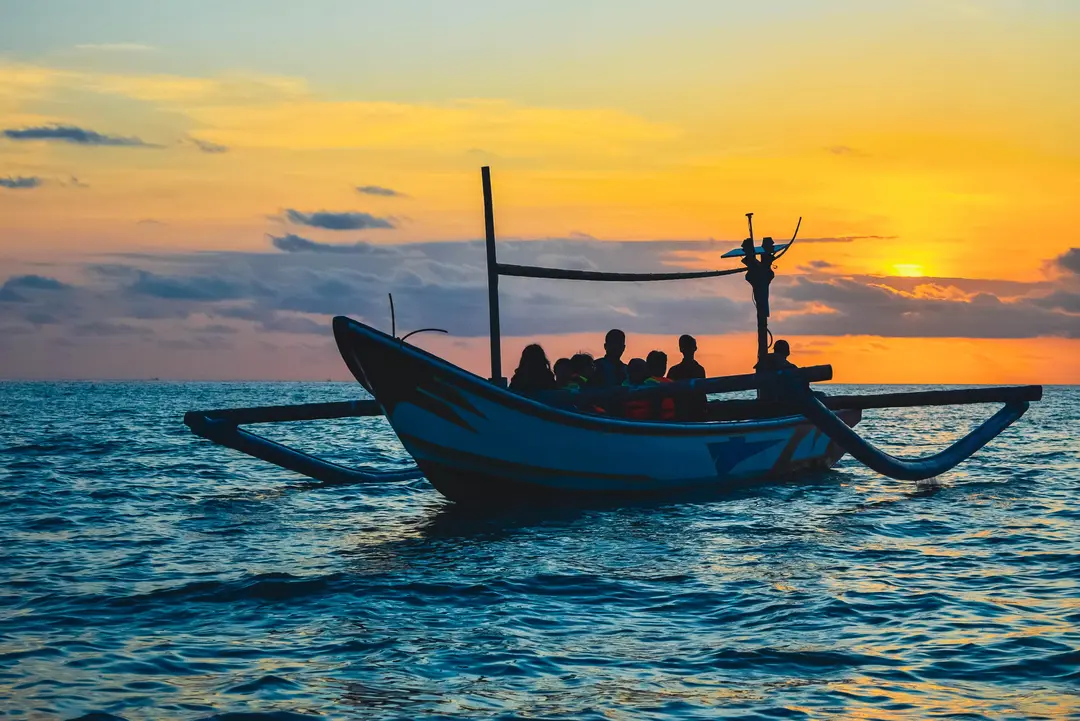 Traditional jukung sunset dinner cruise in Jimbaran Bali